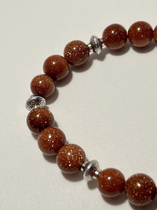 Sandstone with tassel bracelet. Zoomed In.