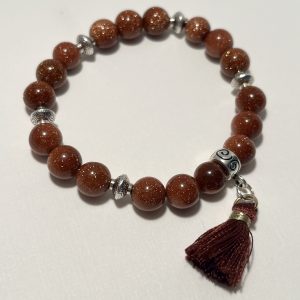 Sandstone with tassel bracelet.