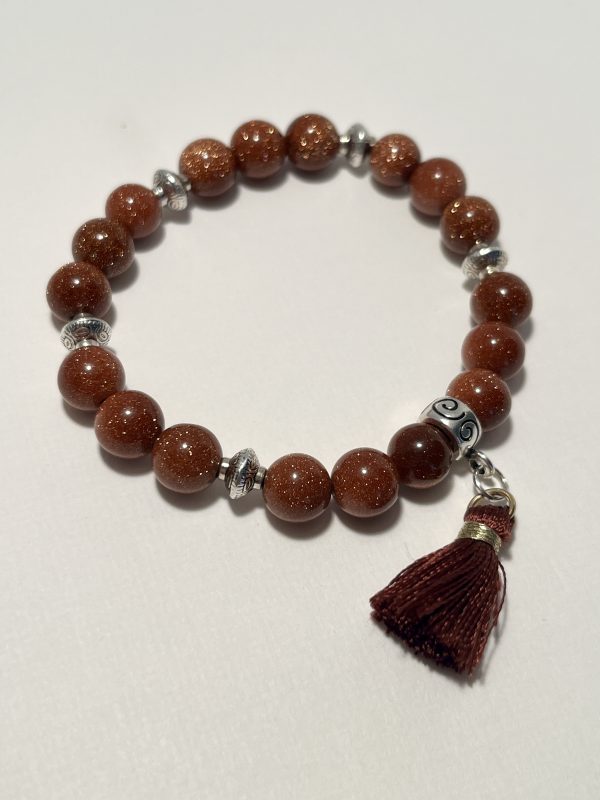 Sandstone with tassel bracelet.